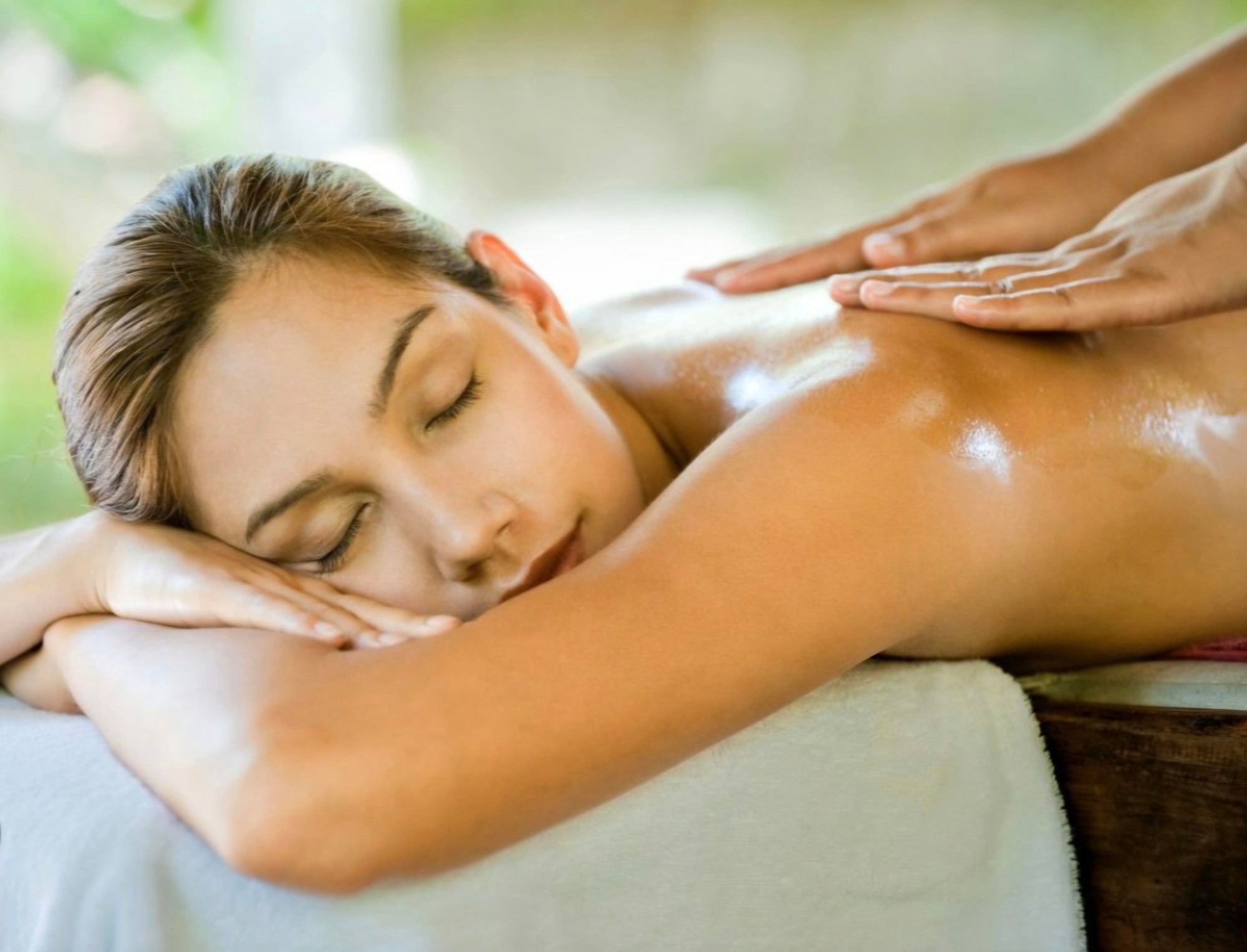 Relaxing oil massage on the back and shoulders